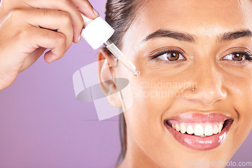 Image of Woman, facial essential oil and serum for dermatology, natural beauty and aesthetic makeup on purple studio background. Happy model face, skincare and liquid cosmetics, retinol and hyaluronic acid