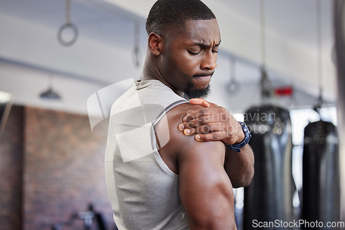 Image of Exercise, black man and shoulder pain for training, fitness and workout for wellness in gym. Nigerian male, athlete and body care with pain, tired and injury for ache, strong and orthopedic problem