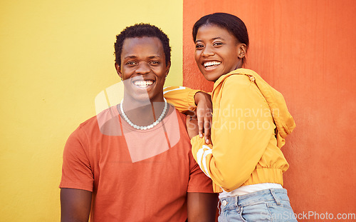 Image of Black couple, youth and fashion with gen z, hug and together with color and portrait against wall background. Black man, black woman and young with trendy streetwear, mockup and marketing in Nigeria.