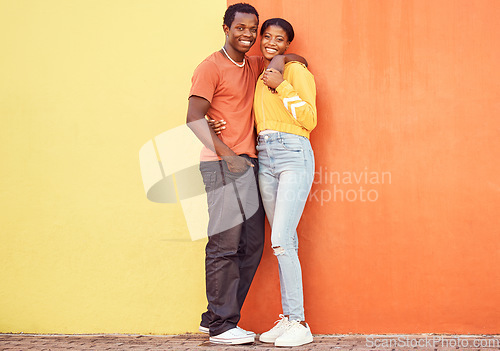 Image of Portrait, love and mockup with a black couple dating outdoor on a color wall background together with mockup. Happy, smile and trust with a man and woman bonding while out in town on a summer day