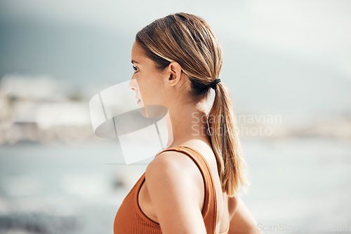 Image of Fitness, yoga and woman at the beach for peace, nature workout and zen training for the mind in Spain. Wellness, exercise and girl thinking of pilates motivation for spiritual health at the sea