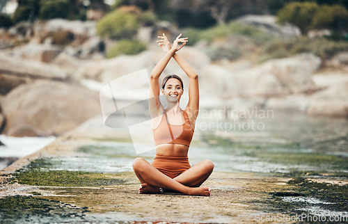 Image of Fitness, yoga and zen, woman at beach stretching for meditation and training in nature for healthy lifestyle. Health, wellness and workout for girl at ocean, pilates exercise for balance at sea water