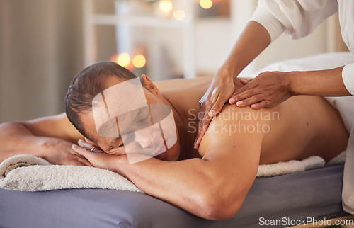 Image of Spa, relax and hands massage man for health, wellness and stress relief at luxury resort. Zen, physical therapy and female therapist massaging back and arm of male for physiotherapy and body care.