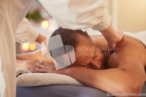 Image of Spa, man and massage for wellness, luxury and relax for health, peace or lying on table. Male person, rich and self care for healthy lifestyle, zen treatment or grooming for stress relief or holistic