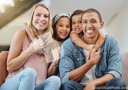 Image of Kids, interracial and family on sofa for portrait, happy family and home together in Chicago, USA. Care, hug and smile of children embracing, happy mom and father with love, bonding and family home