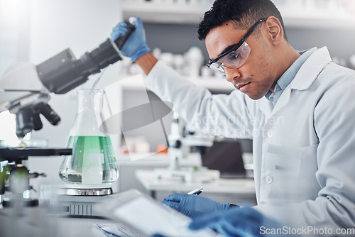 Image of Science, chemistry and beaker with man in laboratory for research, dna and vaccine analysis. Medicine, pharmacy and innovation with expert and flask for medical, biotechnology and experiment