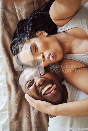 Image of Black couple, love and bedroom selfie while happy and funny together with tongue out on bed at home, apartment or hotel. Portrait of a young man and woman in a happy marriage with commitment and care