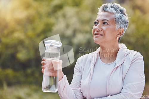 Image of Face, water bottle and senior woman in nature on break after sports workout, exercise or training. Thinking, drinking water and retired female from India with liquid for hydration, health or wellness