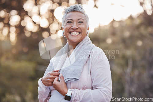Image of Fitness, exercise and happy senior woman in nature with a towel for cardio running workout for health and wellness. Elderly female in a forest to run for a healthy lifestyle, body and energy outdoor