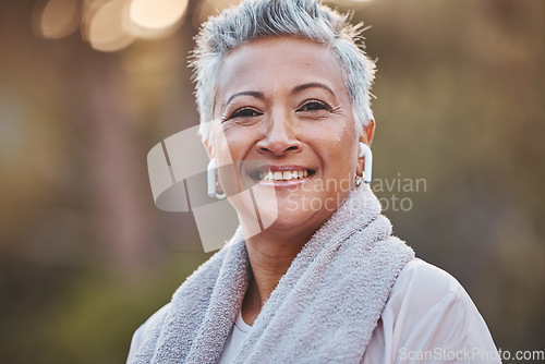 Image of Fitness, nature and portrait of a old woman with music while outdoor for exercise in nature with earphones. Face of elderly female in a forest for a cardio workout for a healthy lifestyle and energy