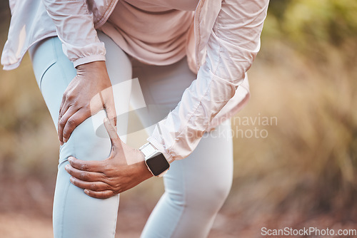 Image of Fitness, knee pain and woman in park after running, exercise and marathon training for healthy lifestyle. Wellness, sports and hands of female athlete with muscle strain, leg injury and accident