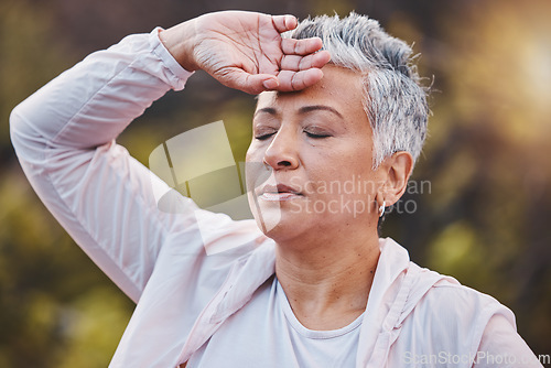 Image of Tired runner, senior woman and breathing outdoor for fitness exercise, running rest and workout training. Nature forest, elderly athlete and closed eyes for breathe, cardio break and sports wellness