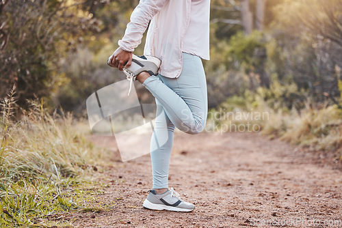 Image of Woman stretching legs in forest and fitness, run outdoor with nature for cardio and health. Runner sneakers, start exercise and running path, workout with sports motivation and marathon training