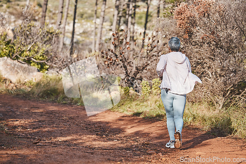 Image of Fitness, runner or old woman running in nature training, exercise or cardio workout in New Zealand. Back view, wellness or healthy senior person exercising with resilience, body goals or motivation