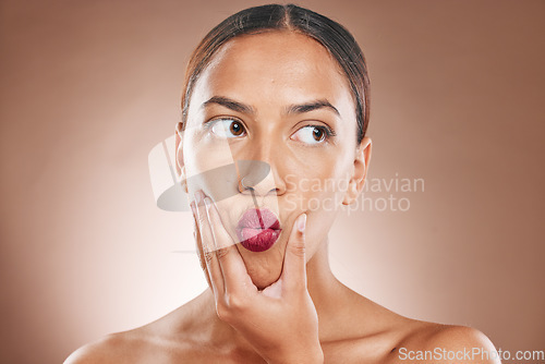 Image of Lips, face and woman with beauty, lipstick pout with hand and makeup with cosmetic care against studio background. Natural cosmetics, facial treatment with healthy skin and skincare wellness mockup