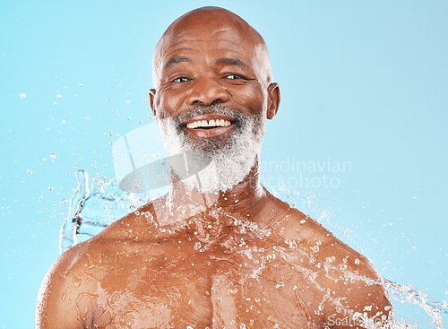 Image of Water splash, senior black man and beauty with face and portrait, hydration and hygiene, healthy skin against blue background. Skincare, clean cosmetics and smile in headshot, water and shower mockup