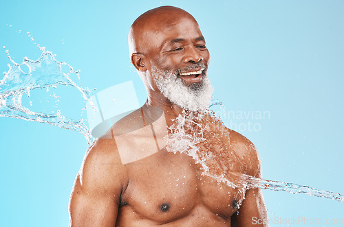 Image of Beauty, health and senior black model with water satisfied with self care, skincare and cleaning routine. Mature cosmetic man washing body with smile for grooming hygiene on blue studio background.