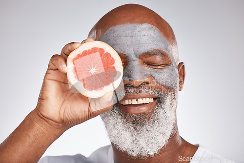 Image of Skincare, face mask or happy old man with grapefruit marketing or advertising natural vegan diet for glowing skin. Cream, smile, senior black man with beauty or healthy anti aging facial cosmetics