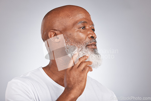 Image of Black man, face and senior skincare with facial hair or beard for grooming and shaving on grey background. Beauty headshot of African male in studio for dermatology, cosmetics and skincare mockup