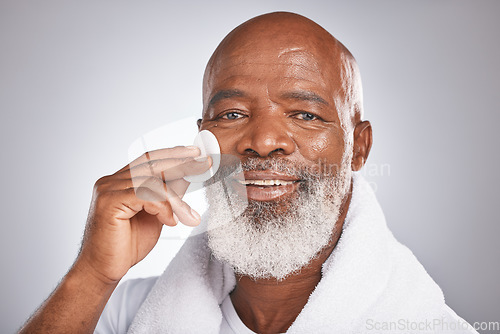 Image of Portrait, cosmetics and black man with facial cotton, skincare and dermatology on grey studio background. African American guy, senior male and makeup pads for face detox, beauty and luxury self care