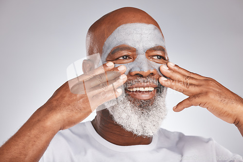 Image of Senior, hands or black man with facial cream marketing or advertising a luxury beauty product for self care. Studio background, cosmetics or African old man with a happy smile applying facial mask