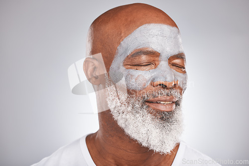 Image of Skincare, beauty or senior black man with face mask marketing or advertising a luxury beauty product for self care. Studio background, facial cosmetics or African old man relaxing with a happy smile