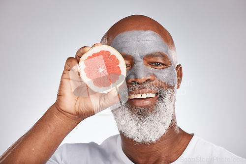 Image of Beauty, face mask or happy old man with grapefruit marketing or advertising natural vegan diet for glowing skin. Cream, portrait, senior black man with skincare or healthy facial grooming cosmetics
