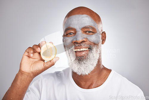 Image of Skincare, lemon or happy old man with face mask marketing or advertising a healthy diet or fruit. Studio background, cosmetics or senior black man with a happy smile applying beauty product cream