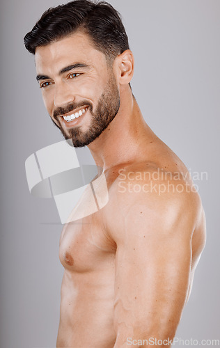 Image of Man, face or body muscles on studio background in workout check, healthcare wellness or training goals. Smile, happy, or fitness model and bodybuilding progress, exercise motivation or personal goals