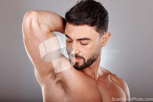 Image of Wellness, skincare and beauty of man for armpit hygiene, grooming and natural cosmetic campaign. Body care, aesthetic and confidence of model with healthy skin glow in gray studio background.