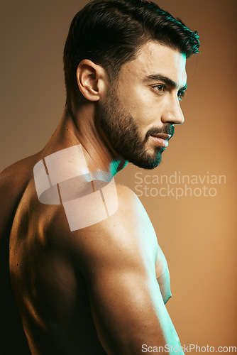 Image of Man, beauty and body in studio with muscle, strong and wellness with vision, goal and cosmetics by backdrop. Young model, skincare and glow with health, aesthetic and self care by studio background