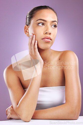 Image of Skincare, beauty and woman with hands on face for cosmetology, beauty products and dermatology. Cosmetics, makeup and Latino girl on purple background for wellness, facial treatment and spa aesthetic