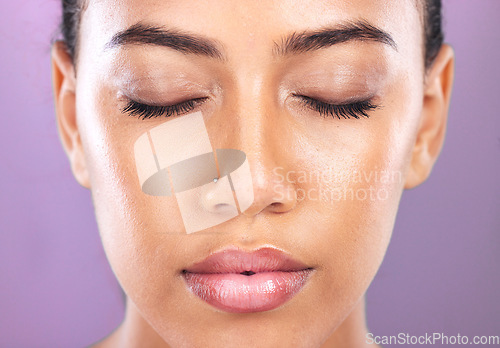 Image of Makeup, cosmetics and zoom face of a woman marketing a spa product, body glamour and care on a purple studio background. Beauty, skincare and headshot of a model advertising cosmetic glow on skin