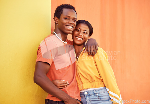 Image of Black couple, youth and fashion with gen z, hug and together with color and portrait against wall background. Black man, black woman and young with trendy streetwear, mockup and marketing in Nigeria.