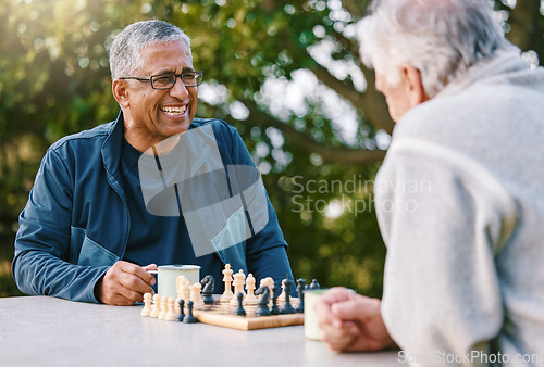 Image of Chess, nature and retirement with senior friends playing a boardgame while bonding outdoor during summer. Park, strategy and game with a mature man and friend thinking about the mental challenge