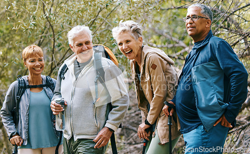 Image of Nature, hiking and happy senior friends bonding, talking and laughing at comic joke in forest. Happiness, fun and group of elderly people trekking together for health, wellness and exercise in woods.