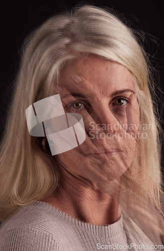 Image of Mental health, hand and portrait with a senior woman in studio on a dark background suffering from depression. Fear, anxiety and face with a mature female struggling with her identity on overlay