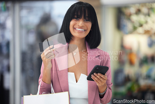 Image of Happy woman, shopping and portrait with credit card using phone for ecommerce payment and online banking. Paper bag, fashion and female excited about discount, promotion and commerce app on travel