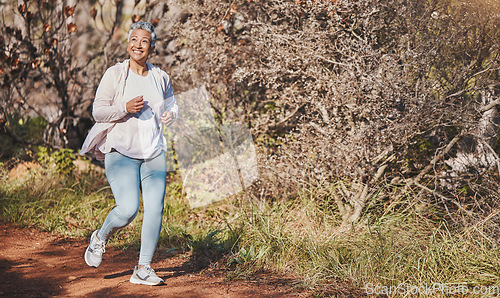 Image of Fitness, happy and senior woman running in nature for cardio, morning motivation and marathon training in Australia. Freedom, wellness and elderly runner with a smile for outdoor exercise in a park