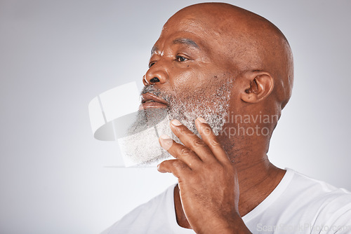 Image of Senior black man, face and self care with skincare, dermatology and cosmetics for clean and fresh skin. Headshot of African male on grey studio background for beauty and beard hygiene and grooming