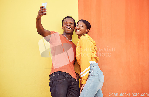 Image of Selfie, black couple and smile with gen z youth, smartphone and influencer with post for social media against color wall background. Happy in picture, fashion mockup and tech with young man and woman