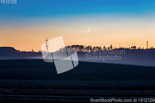 Image of countryside landscape after sunset with moon