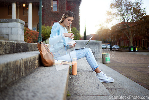 Image of College, study and food with woman and laptop for education, lunch break and academy research. University, knowledge and goal with girl student and sandwich on stairs of campus for relax and learning