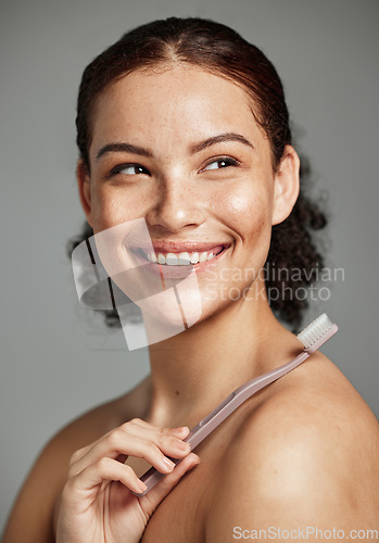 Image of Toothbrush, woman brushing teeth and dental wellness with hygiene, cleaning and teeth whitening. Face of a happy female with a smile for oral health, healthy mouth and self care on studio background