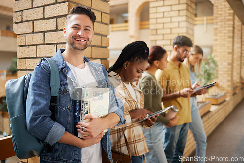 Image of University, hallway and portrait of man and students standing in row together with books and tablet before class. Friends, education and future, happy man in study group on campus in lobby for exam.