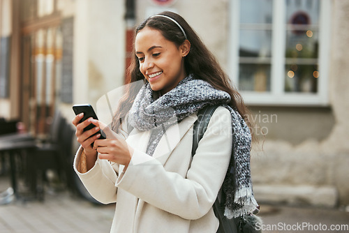 Image of Woman, outdoor and smartphone for connection, social media and communication. Female student, academic and cellphone to search online, smile and website to scroll internet, happiness and typing