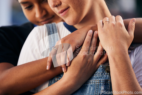 Image of Hands, love and lgbt with a woman couple hugging outdoor for romance, dating or non binary affection. Hug, date and gay with a gender neutral female and partner sharing an intimate moment together