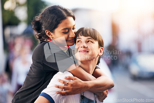 Image of Piggyback, love and lgbtq couple in the city, happy support and playful smile in Switzerland. Affection, hug and calm lesbian women smiling with pride in identity the urban street on the weekend