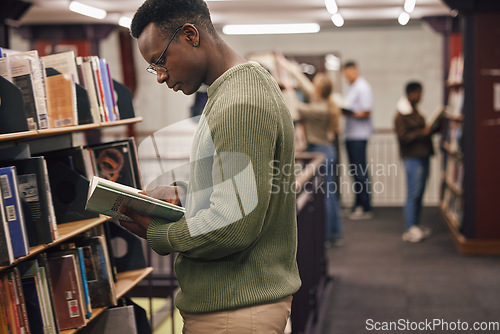 Image of Black man student, reading and library with book, research and education at college to ready for exam. African gen z man, books and shelf at university for study, learning and motivation in Boston