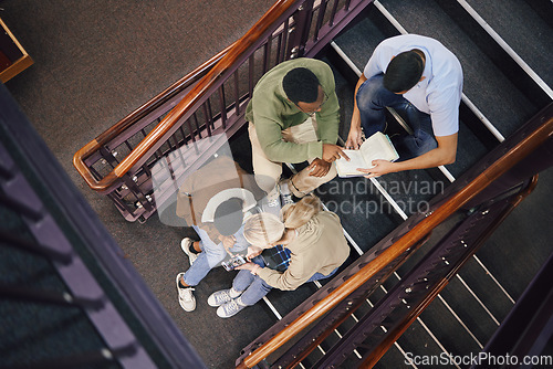 Image of Above, student group and stairs for study together, thinking and research for exam, test or education. Students, diversity and teamwork for support, ideas and collaboration at university for mission